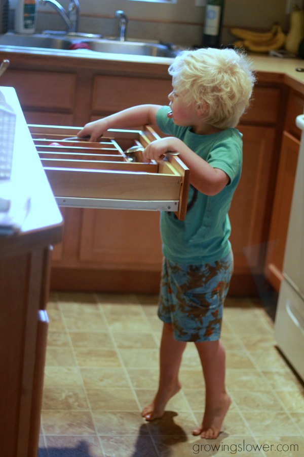 Even my 3 year old gets involved in our morning routine. Here he is putting away the silverware while I unload the rest of the dishwasher. 