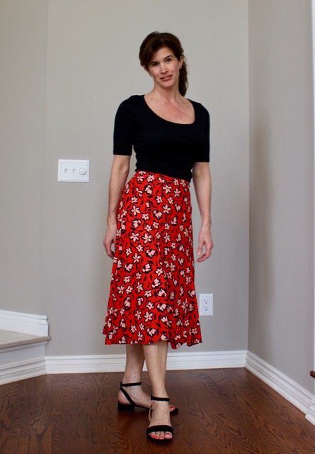 You can dress up a casual skirt with strappy black heels.